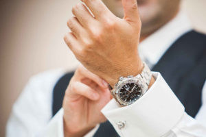 Groom putting on Tag Heuer Watch